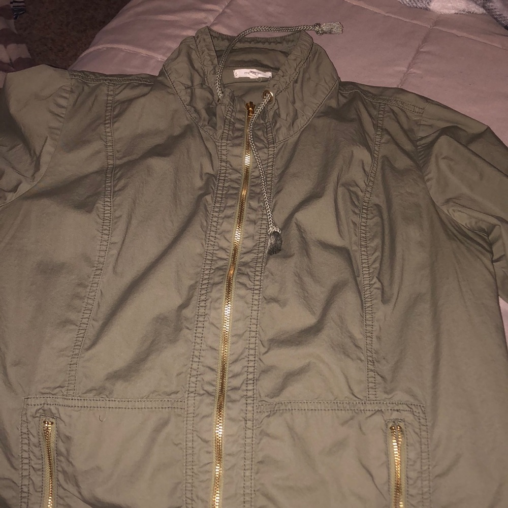 navy green jacket with gold zipper and decoration